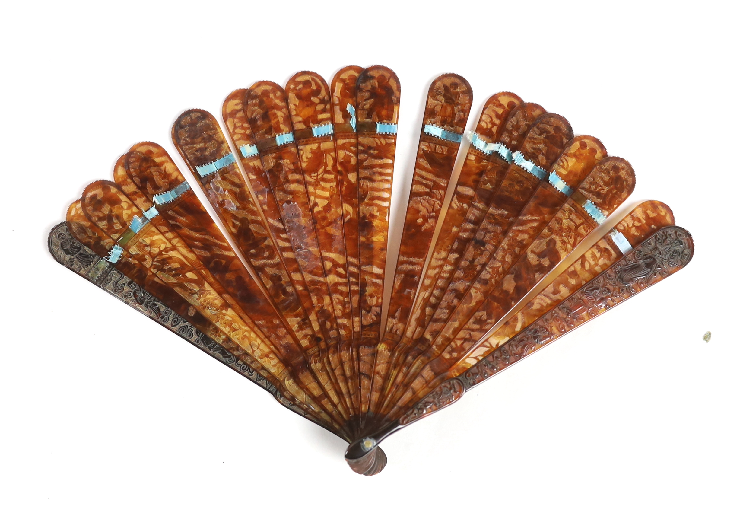 A 19th century Chinese finely carved tortoiseshell brisé fan, 18cm high